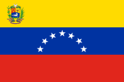 yellow-blue-red, arc of 7 white stars, coat of arms