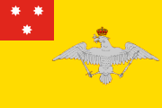 yellow, red canton, three white 8-pointed stars, coat of arms
